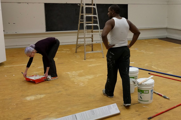 Volunteer Hadley Dean helping out in our first months to paint classrooms with Board Member Travis Alvarez